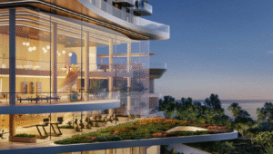Modern building interior with gym and green roof overlooking the sea