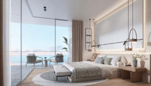 Bright bedroom with a sea view balcony and contemporary furnishings.